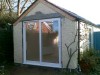 Garage conversion to artist's studio, with patio doors by HMC Joinery & Building, Belfast.
